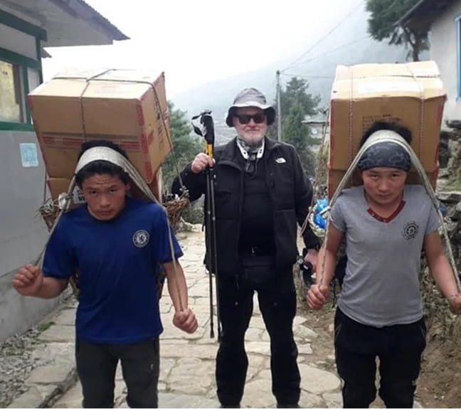 Trekkers and porters in mountain region
